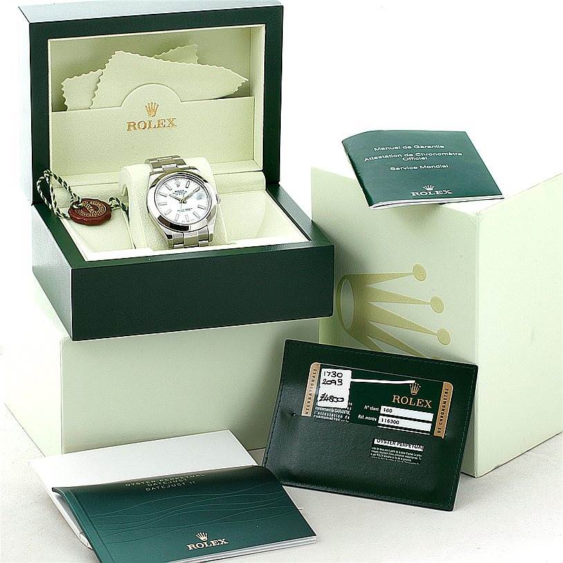 The image shows a Rolex Datejust 41 116300 Men's Stainless Steel White Dial 116300 Men's Stainless Steel White Dial watch in its box, along with manuals, a warranty card, and a tag.