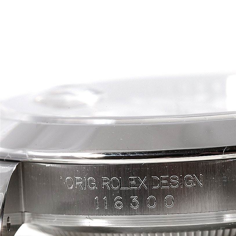 The image shows a close-up side view of the Rolex Datejust 41 116300 Men's Stainless Steel White Dial 116300 Men's Stainless Steel White Dial, highlighting the engraved serial number and part of the case.