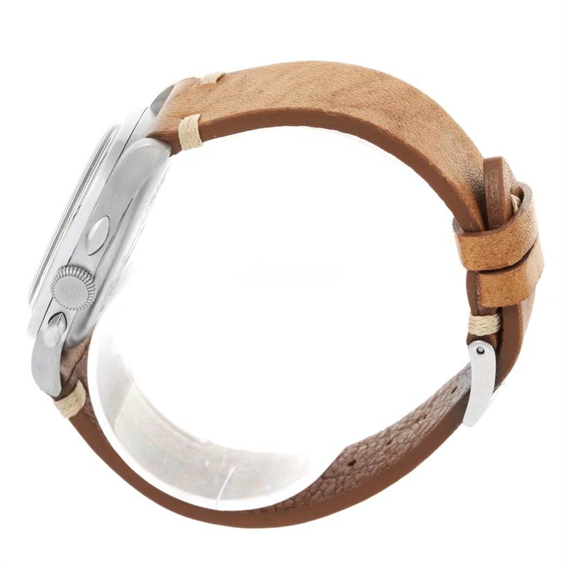 The Omega Museum 5702.50.02 Men's Stainless Steel Black Dial 5702.50.02 Men's Stainless Steel Black Dial model watch is shown from the side, highlighting its case, side buttons, crown, and brown leather strap.