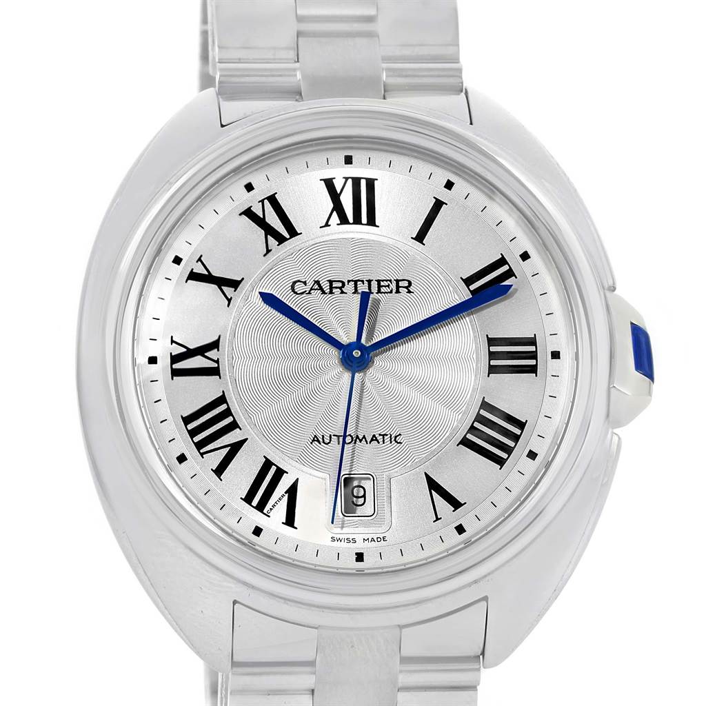 This is a front angle close-up of the Cle de Cartier watch, showing the dial, Roman numeral markers, blue hands, and crown with blue accent.