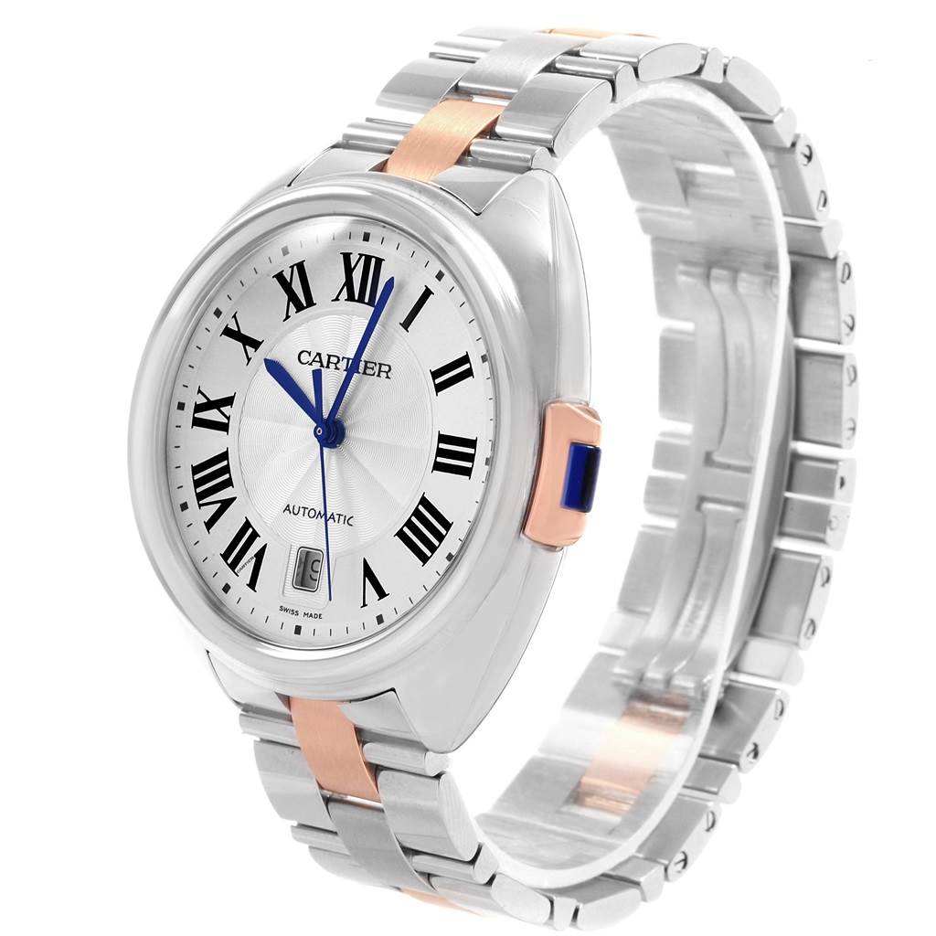 The image shows a Cle de Cartier watch from an angled side view, highlighting the face, case, and bracelet.