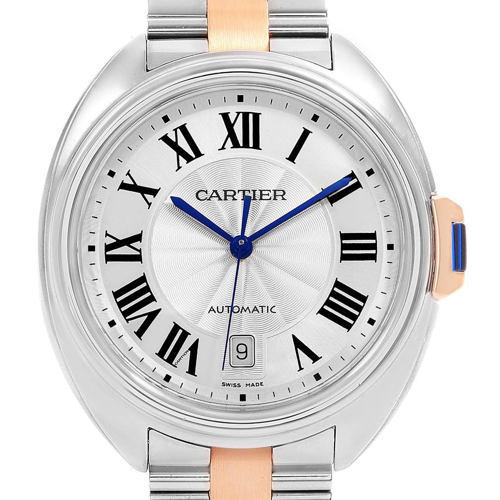 This is a front view of a Cle model watch by Cartier, showing the dial, hands, and part of the bracelet.