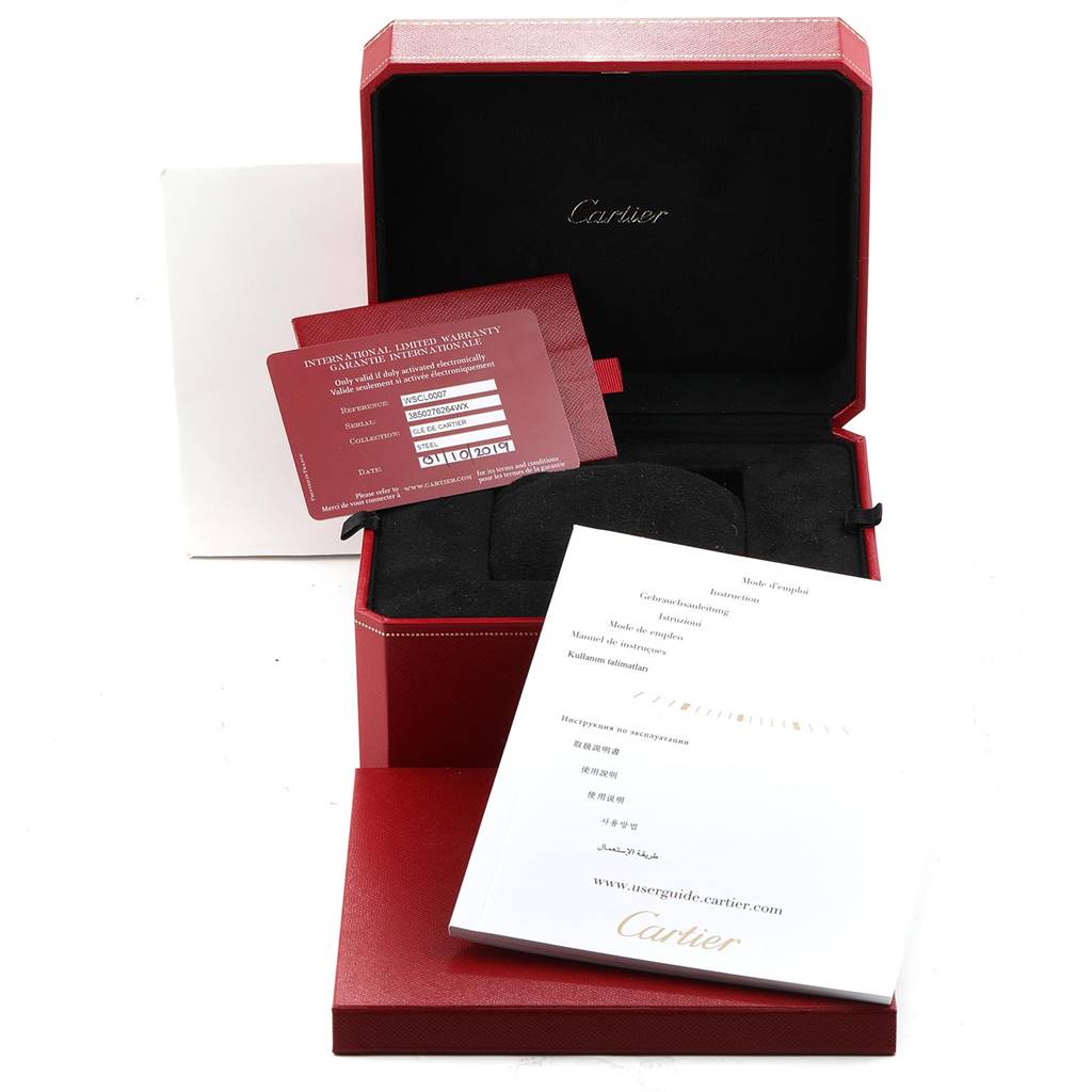 The image shows the box, international warranty card, cushion, and user manual for the Cartier Cle WSCL0007 Men's Stainless Steel Silver Dial WSCL0007 Men's Stainless Steel Silver Dial watch.