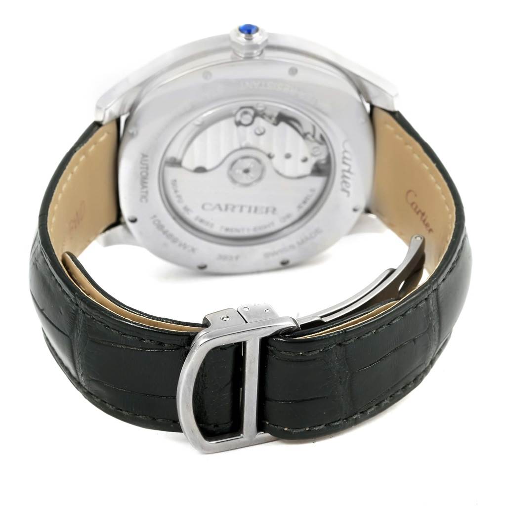 The image shows the back view of the Drive de Cartier watch by Cartier, featuring the movement and leather strap.