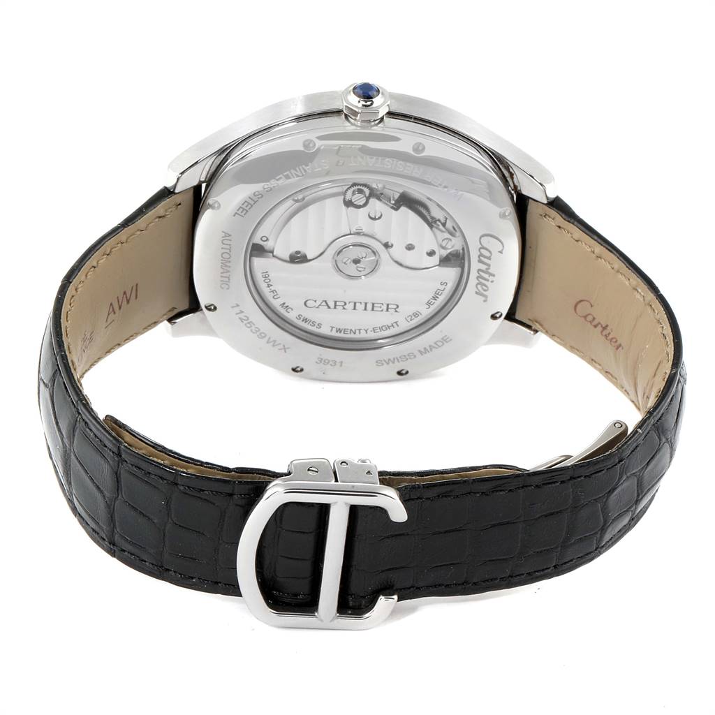 The image shows the back view of a Drive de Cartier watch by Cartier, including the case back, movement, and black leather strap with buckle.