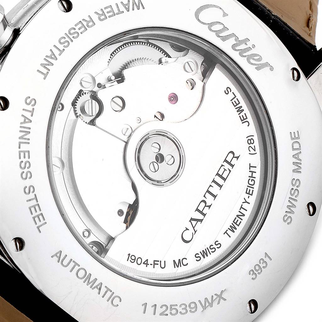 The image shows the back of a Drive de Cartier watch by Cartier, highlighting its automatic movement and internal components.