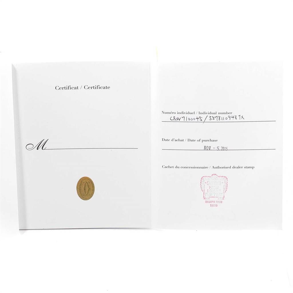 This image shows the open certificate booklet for the Calibre de Cartier watch by Cartier, displaying the individual number and date of purchase.