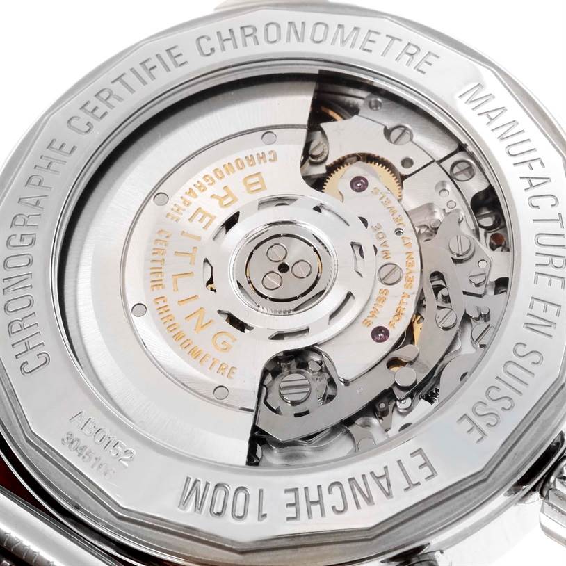 The image shows a close-up of the transparent case back revealing the intricate movement of the Breitling Transocean AB015212/G724-154A Men
s Stainless Steel Silver Dial AB015212/G724-154A Men
s Stainless Steel Silver Dial watch.