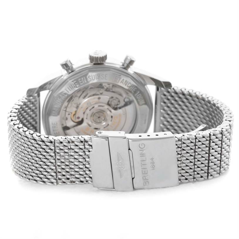 This image shows the back view of a Breitling Transocean AB015212/G724-154A Men
s Stainless Steel Silver Dial AB015212/G724-154A Men
s Stainless Steel Silver Dial watch, highlighting its open case back and metal mesh bracelet with clasp.