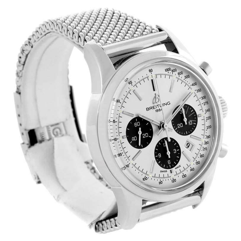 The Breitling Transocean AB015212/G724-154A Men
s Stainless Steel Silver Dial AB015212/G724-154A Men
s Stainless Steel Silver Dial watch is shown at an angled side view, displaying its face, chronographs, crown, and mesh strap.