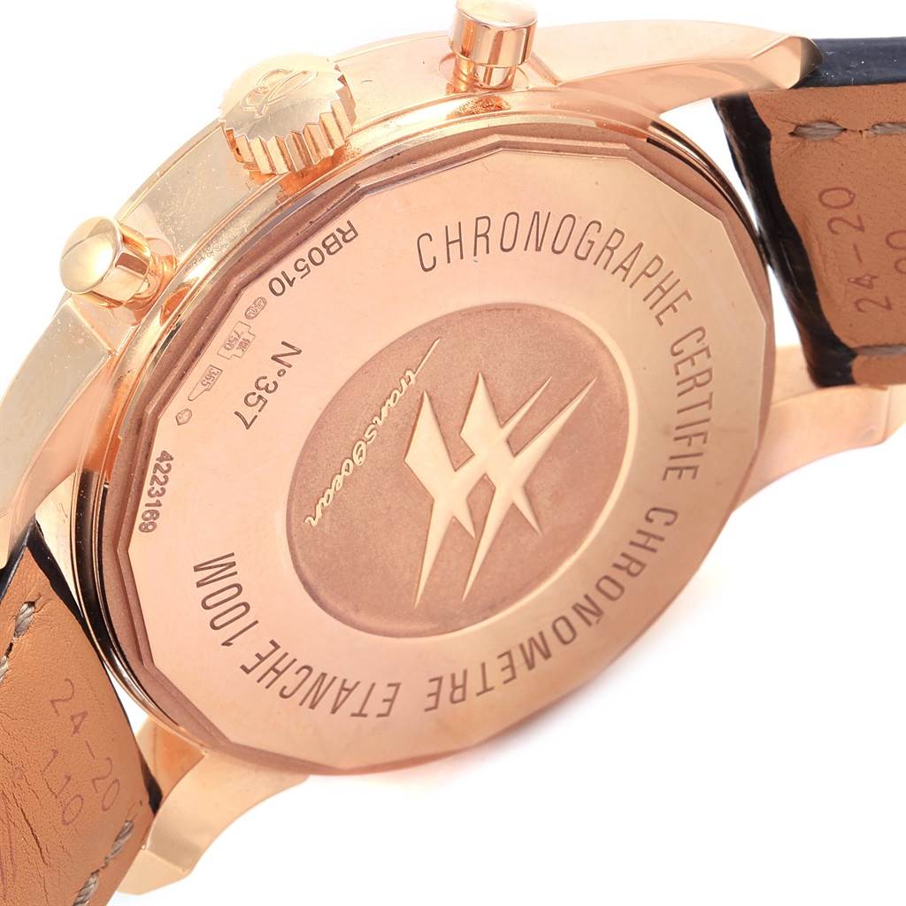 The image shows the back case and part of the leather strap of the Breitling Transocean RB0510U4-BB63BKLD Men's Rose Gold Black Dial RB0510U4-BB63BKLD Men's Rose Gold Black Dial watch at an angle.