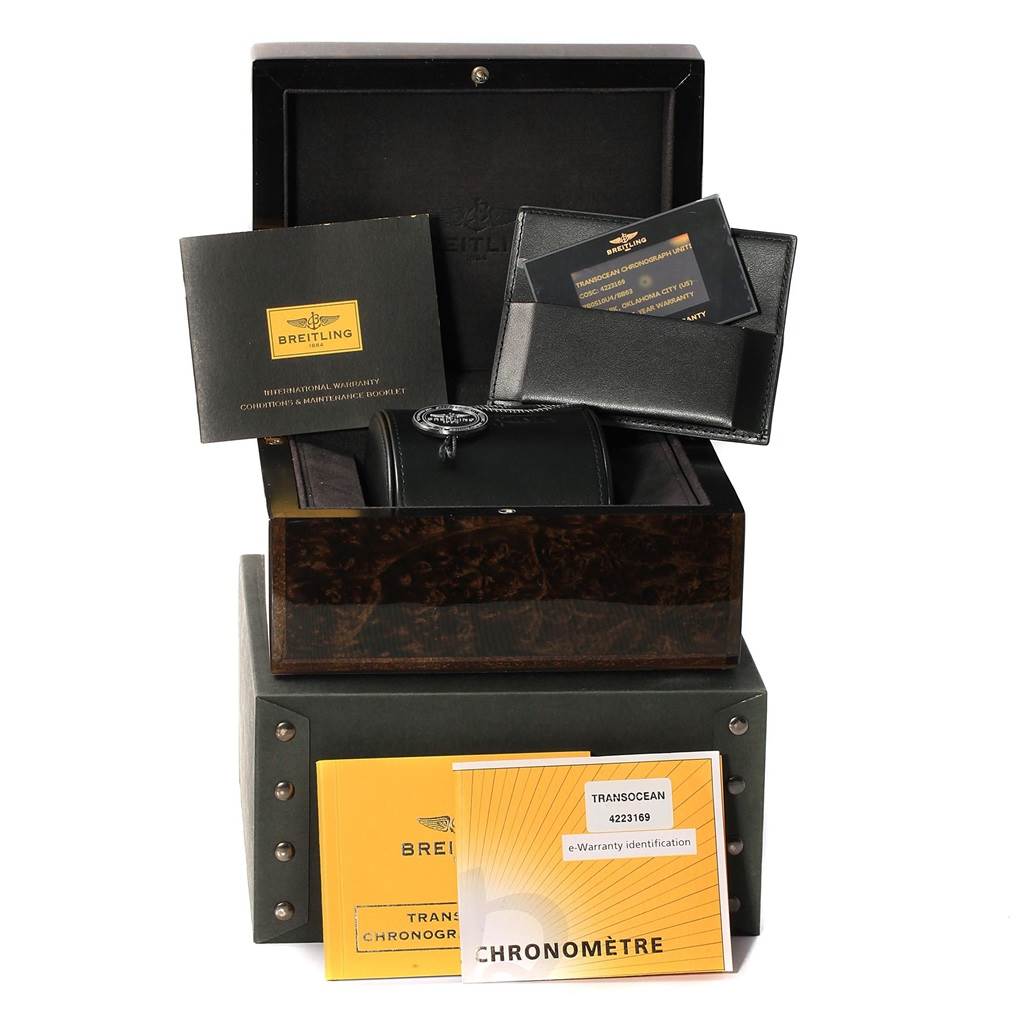 The image shows the packaging, including warranty cards, and manuals for a Breitling Transocean RB0510U4-BB63BKLD Men's Rose Gold Black Dial RB0510U4-BB63BKLD Men's Rose Gold Black Dial watch.