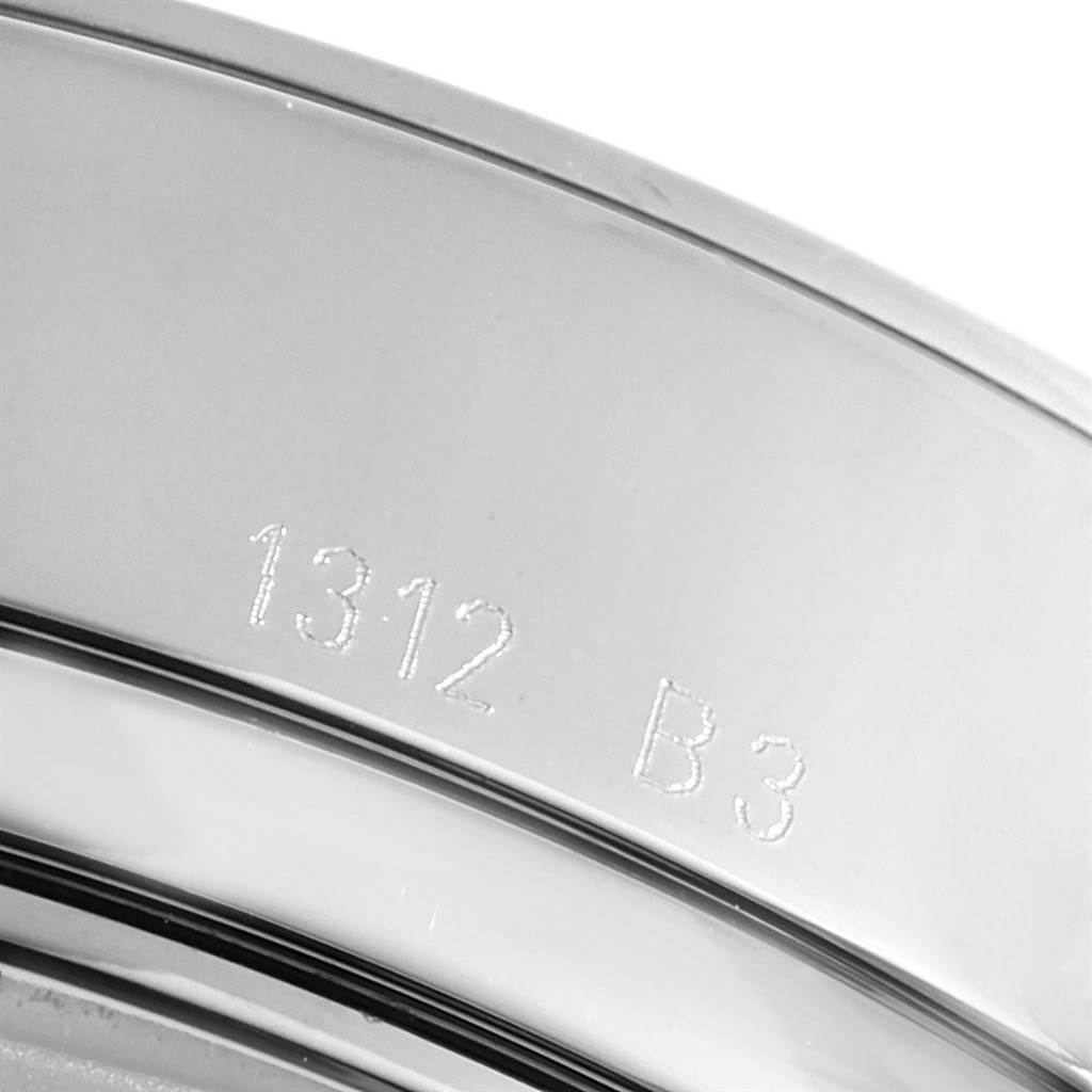 The image shows a close-up of the bezel and part of the case of the Transocean model by Breitling, featuring engraved markings.