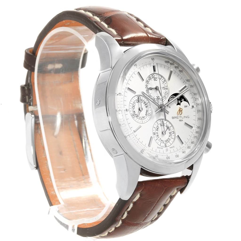 This image shows a side-angle view of the Breitling Transocean A19310 Men's Stainless Steel Silver Dial A19310 Men's Stainless Steel Silver Dial watch, highlighting its dial and brown leather strap.