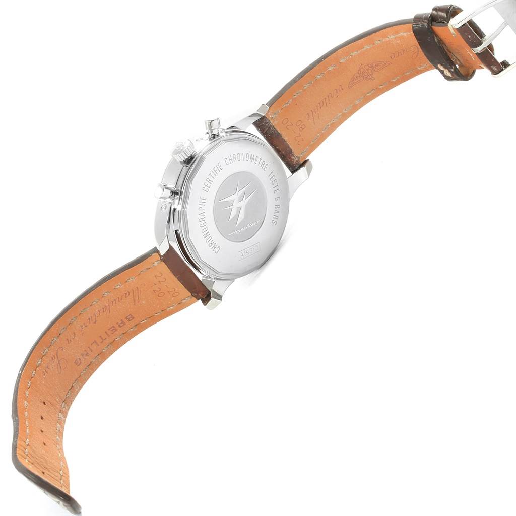 The image shows the back view of a Breitling Transocean A19310 Men's Stainless Steel Silver Dial A19310 Men's Stainless Steel Silver Dial watch with its leather strap and engraved case back visible.