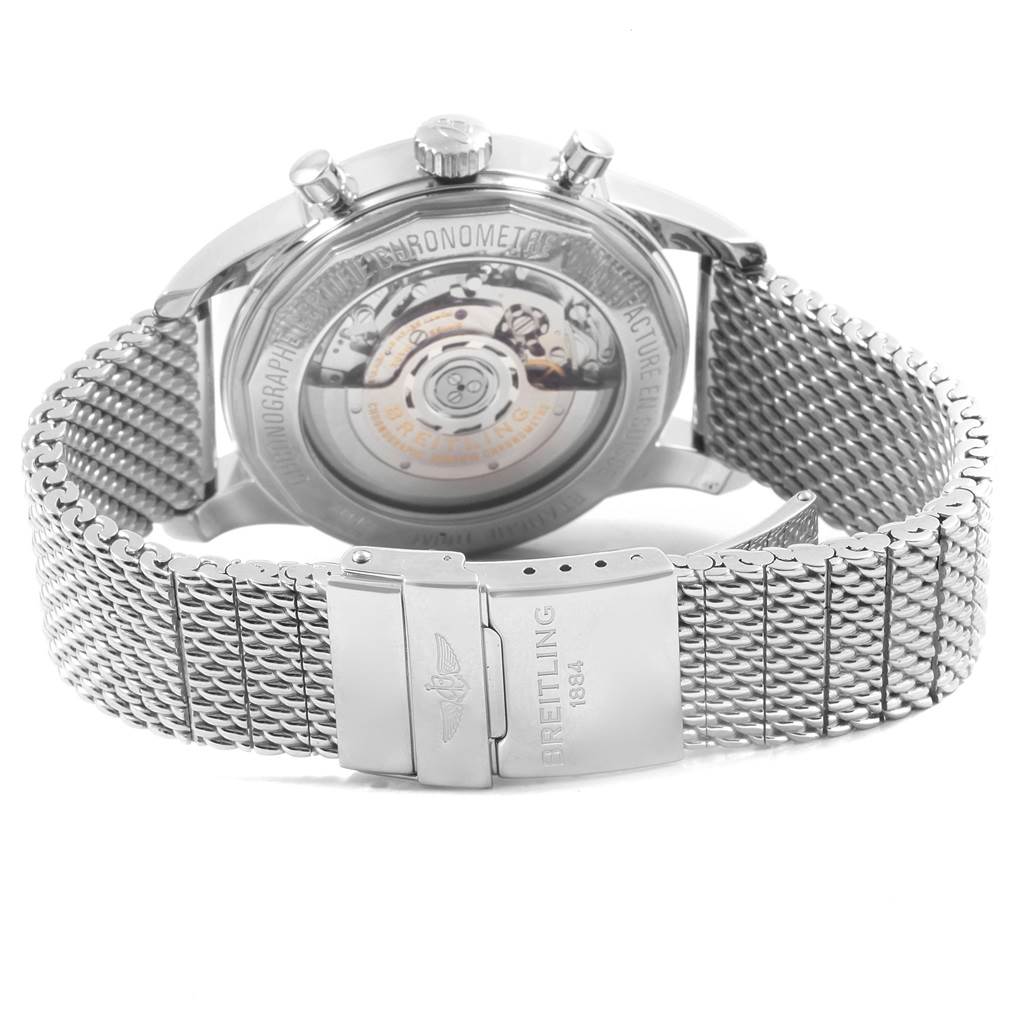 The image shows the back view of a Breitling Transocean AB015212/BA99/154A Men's Stainless Steel Black Dial AB015212/BA99/154A Men's Stainless Steel Black Dial watch, highlighting its transparent case back and metal mesh strap with the logo.