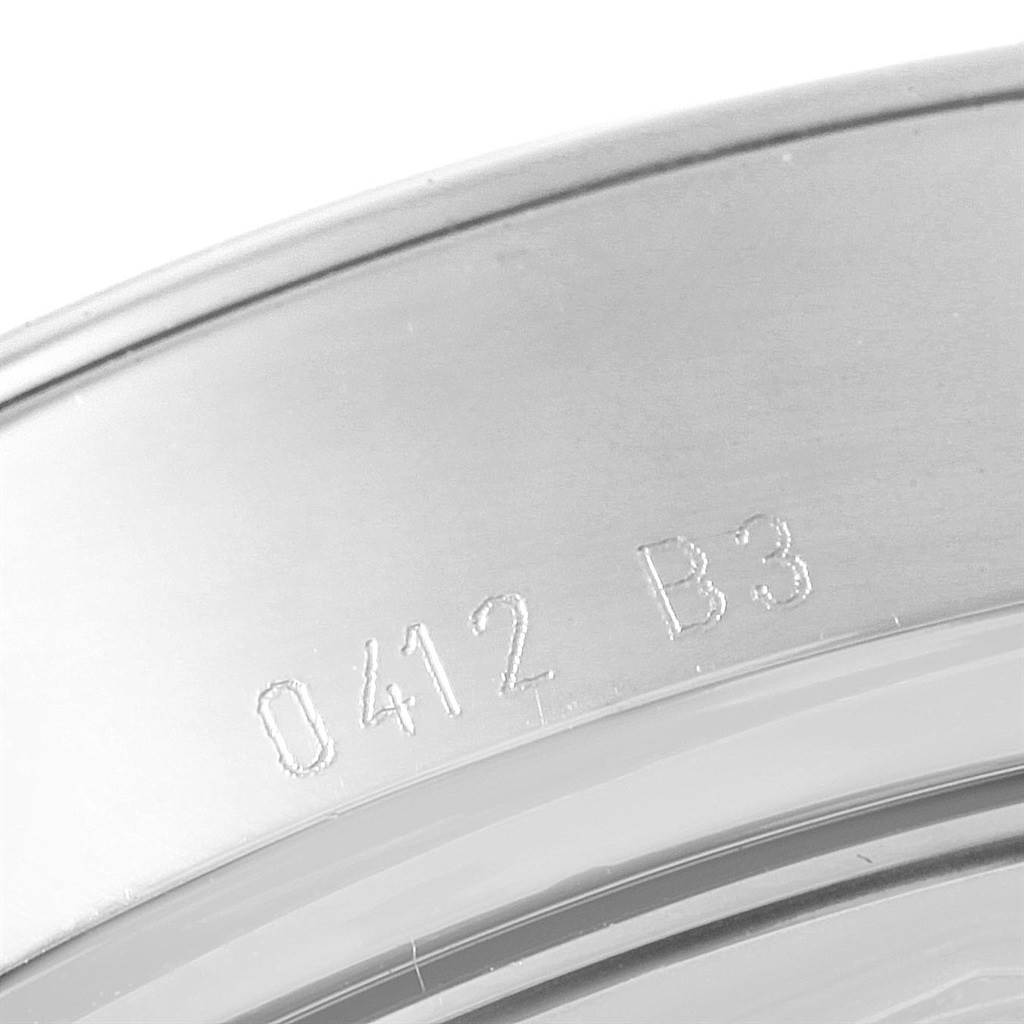 This image shows a close-up view of the engraved markings on the back case of the Breitling Transocean AB015212/BA99/154A Men's Stainless Steel Black Dial AB015212/BA99/154A Men's Stainless Steel Black Dial watch.