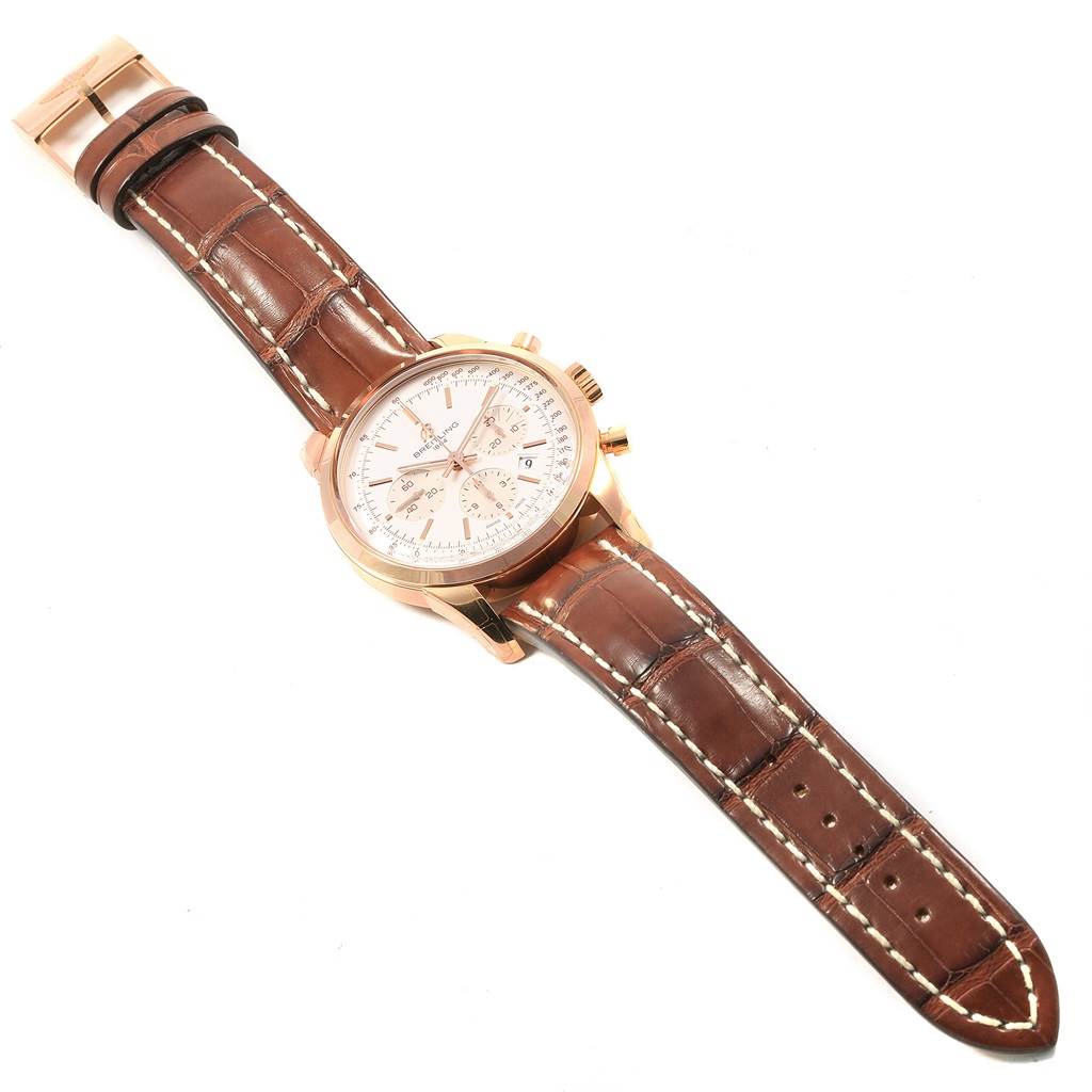 The Breitling Transocean RB0152 Men's Rose Gold Silver Dial RB0152 Men's Rose Gold Silver Dial watch is shown flat from above, displaying the face, case, and brown leather strap.