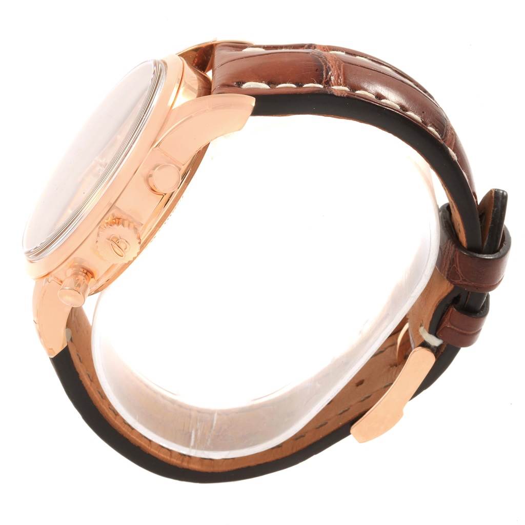 The image shows a side view of a Breitling Transocean RB0152 Men's Rose Gold Silver Dial RB0152 Men's Rose Gold Silver Dial watch, highlighting the case, crown, pushers, and brown leather strap.