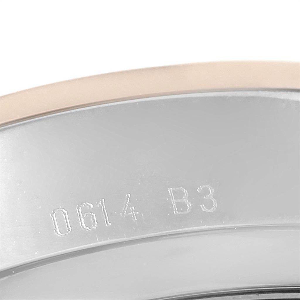 The image shows a close-up of the serial number on the metal casing of a Breitling Transocean U41310 Men's Stainless Steel Brown Dial U41310 Men's Stainless Steel Brown Dial watch.