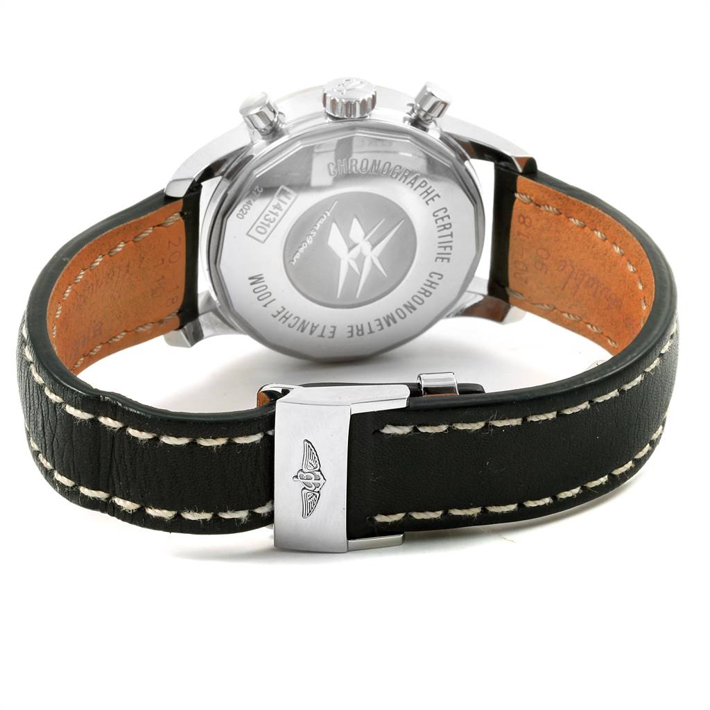 The image shows the back and clasp of a Breitling Transocean U41310 Men's Stainless Steel Brown Dial U41310 Men's Stainless Steel Brown Dial watch, highlighting its leather strap and engraved caseback.