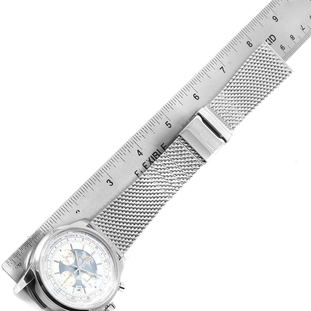 The image shows the Breitling Transocean AB0510 Men's Stainless Steel Silver Dial AB0510 Men's Stainless Steel Silver Dial watch face and a portion of its mesh bracelet, with a ruler for scale.