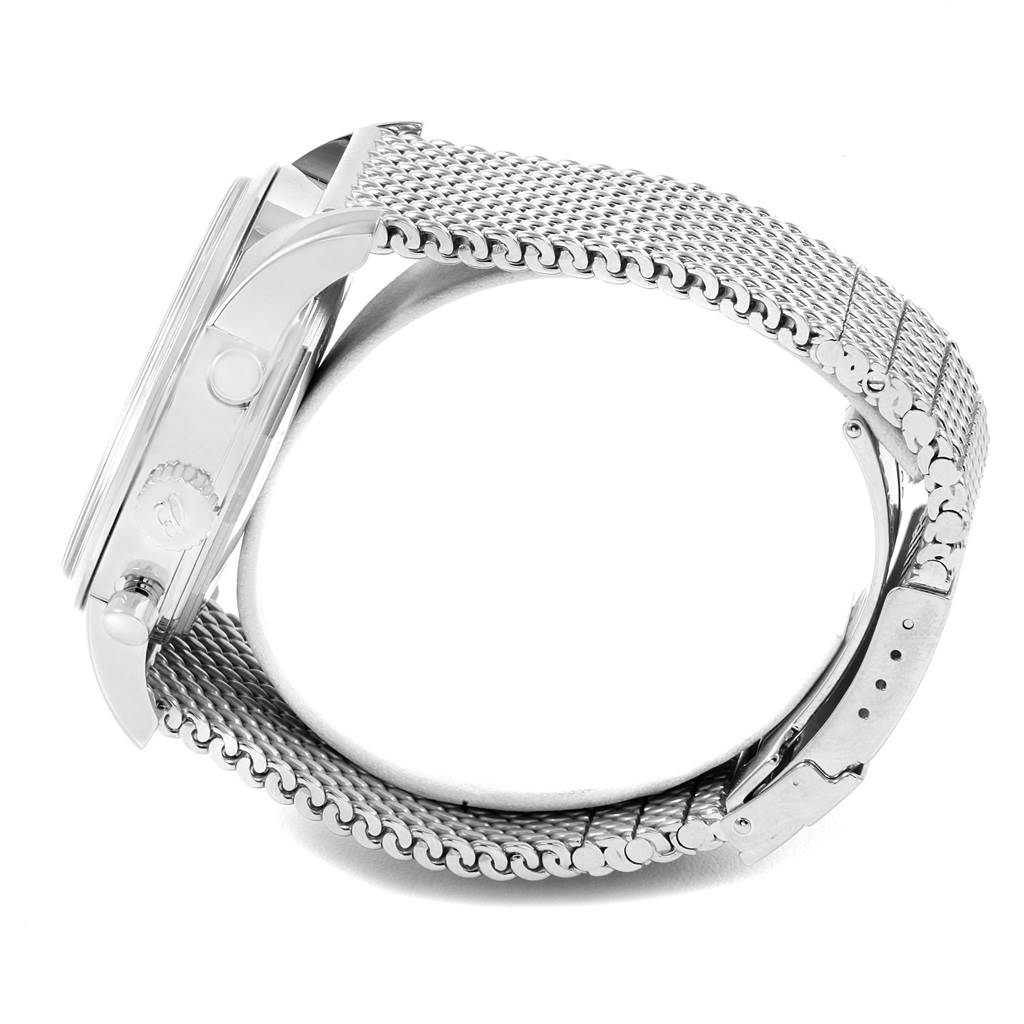 The image shows the side profile of a Breitling Transocean AB0510 Men's Stainless Steel Silver Dial AB0510 Men's Stainless Steel Silver Dial watch, highlighting the case, crown, and mesh bracelet.