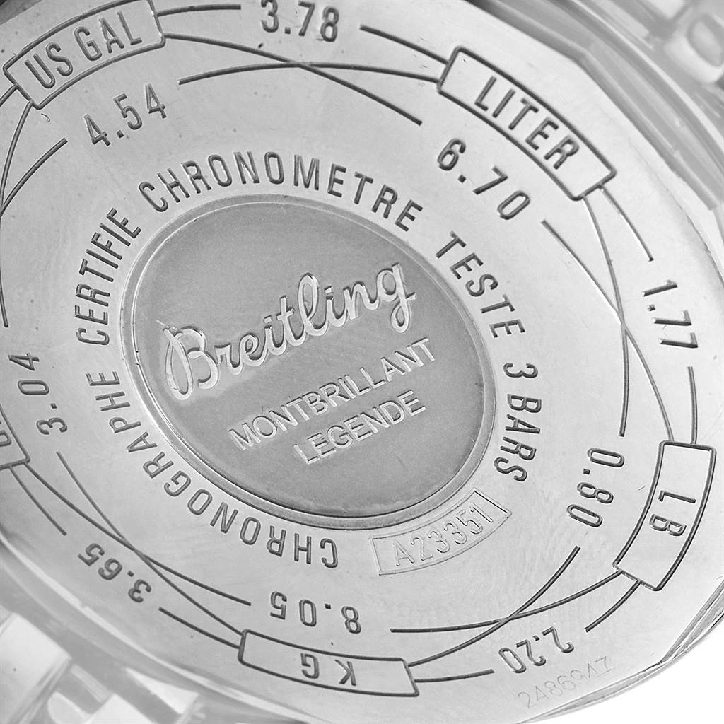 The image shows the back case of a Breitling Montbrillant Legende Chronographe, displaying measurement conversions and the model number.