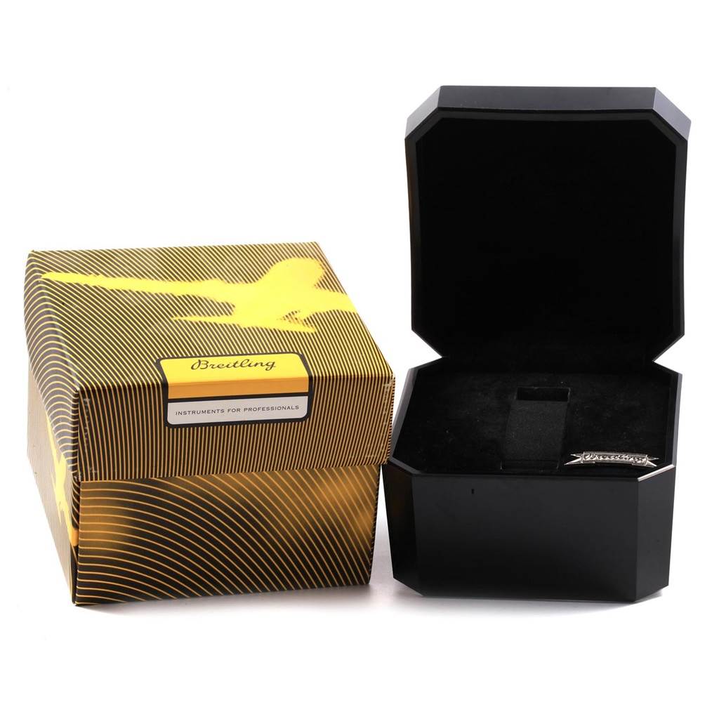 The image shows a closed Breitling Transocean A23351 Men's Stainless Steel Black Dial A23351 Men's Stainless Steel Black Dial watch box and an open black display case.