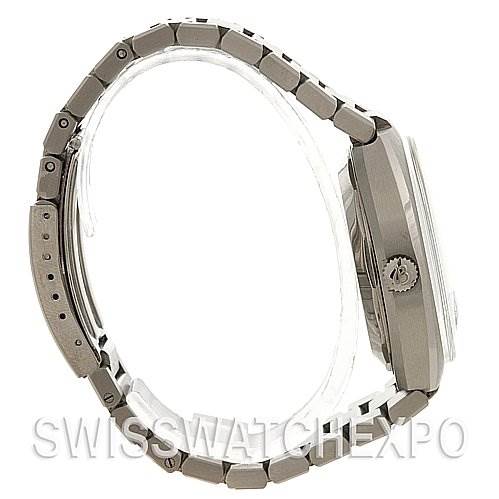 The image shows a side view of the Breitling Transocean 2129 Men's Stainless Steel Silver Dial 2129 Men's Stainless Steel Silver Dial watch, highlighting its case, crown, and metal bracelet.