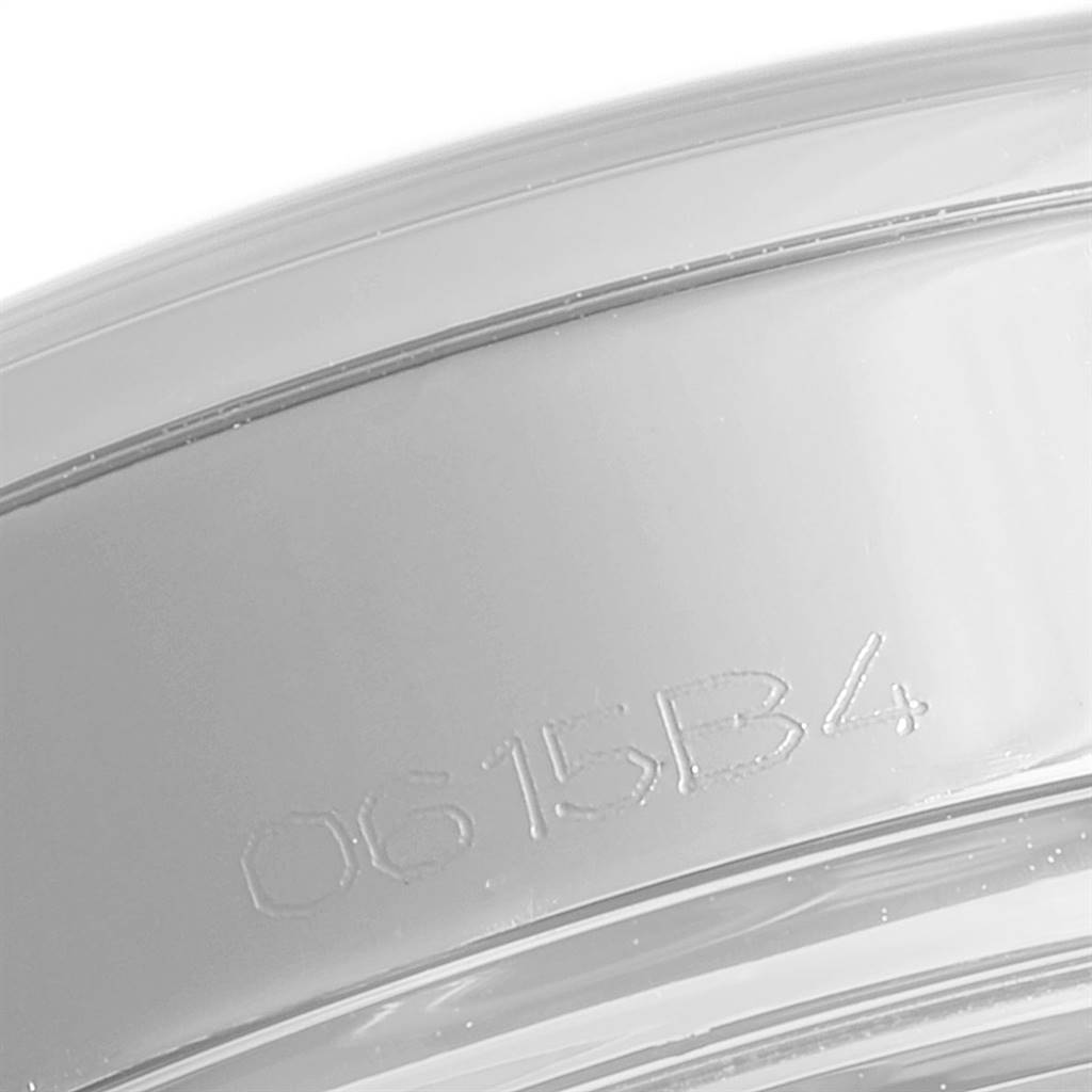 This image shows a close-up of the outer rim or bezel of a Breitling Transocean AB141112/G799-154A Men's Stainless Steel Silver Dial AB141112/G799-154A Men's Stainless Steel Silver Dial watch, featuring an inscription or code.