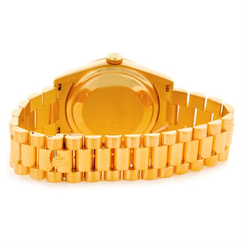 The image shows the back view of a Rolex President 118238 Men's Yellow Gold Silver Dial 118238 Men's Yellow Gold Silver Dial model watch, focusing on its gold case and bracelet.
