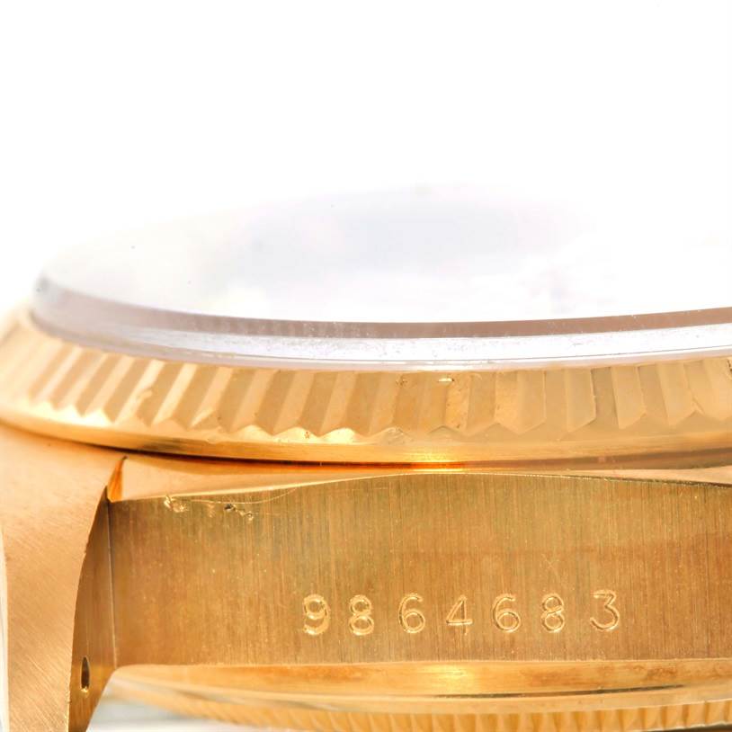 This image shows a close-up of the side casing and fluted bezel of a Rolex President 18038 Men
s Yellow Gold Silver Dial 18038 Men
s Yellow Gold Silver Dial model watch.