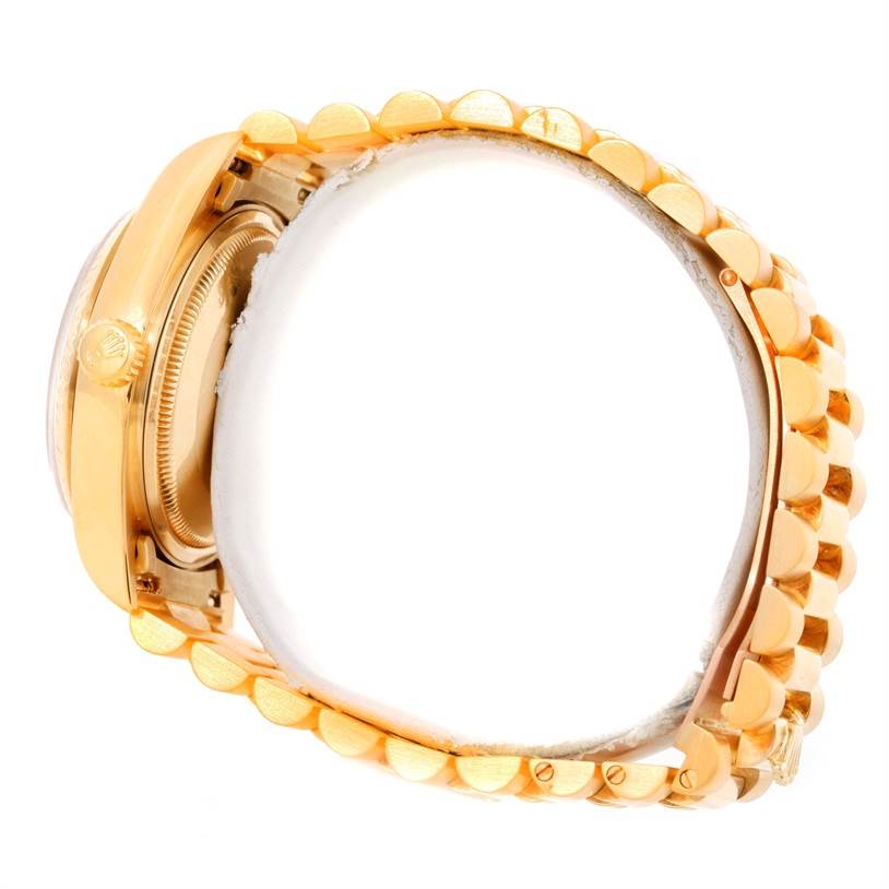 The image shows a side view of the Rolex President 18038 Men
s Yellow Gold Silver Dial 18038 Men
s Yellow Gold Silver Dial model, highlighting the bezel, crown, and bracelet.