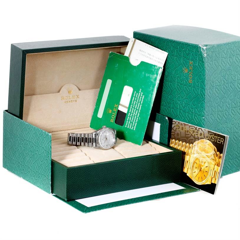 This image shows a Rolex President 18239 Men's White Gold Silver Dial 18239 Men's White Gold Silver Dial watch in its open box with accompanying booklets and warranty card.