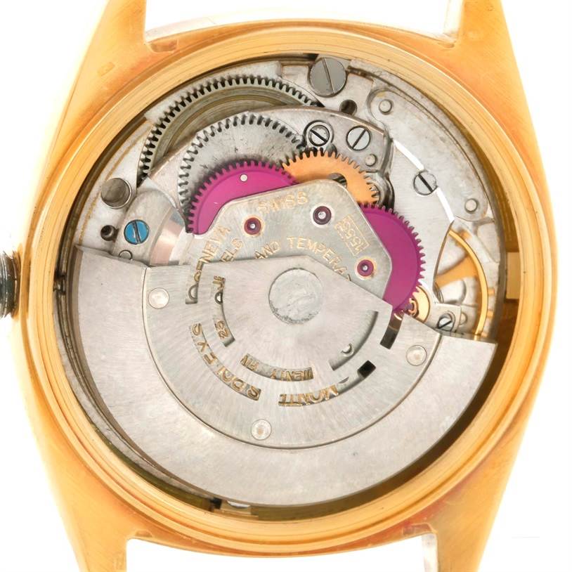 This image shows an internal view of a Rolex President 1803 Men
s Yellow Gold Champagne Dial 1803 Men
s Yellow Gold Champagne Dial model watch, highlighting the movement and gears from the back angle.