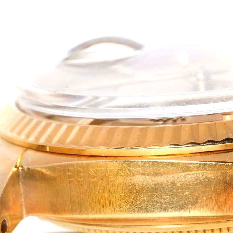 This image shows a close-up side view of the bezel, crystal, and case of a Rolex President 1803 Men
s Yellow Gold Champagne Dial 1803 Men
s Yellow Gold Champagne Dial model watch.