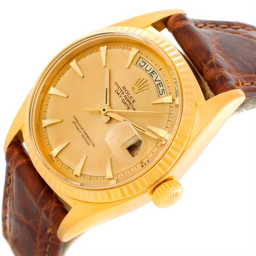 This image shows a Rolex President 1803 Men
s Yellow Gold Champagne Dial 1803 Men
s Yellow Gold Champagne Dial model watch at a slight angle, highlighting the dial, crown, and part of the leather strap.