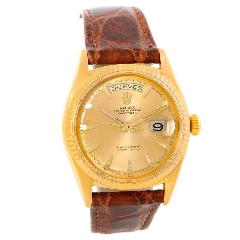 The image shows a frontal view of the Rolex President 1803 Men
s Yellow Gold Champagne Dial 1803 Men
s Yellow Gold Champagne Dial watch, featuring a gold case, brown leather strap, and date display.