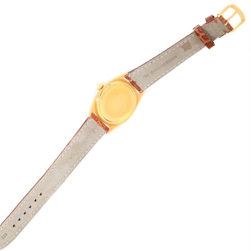 This is a top view of a Rolex President 1803 Men
s Yellow Gold Champagne Dial 1803 Men
s Yellow Gold Champagne Dial model showing the watch case and both sides of the leather strap.