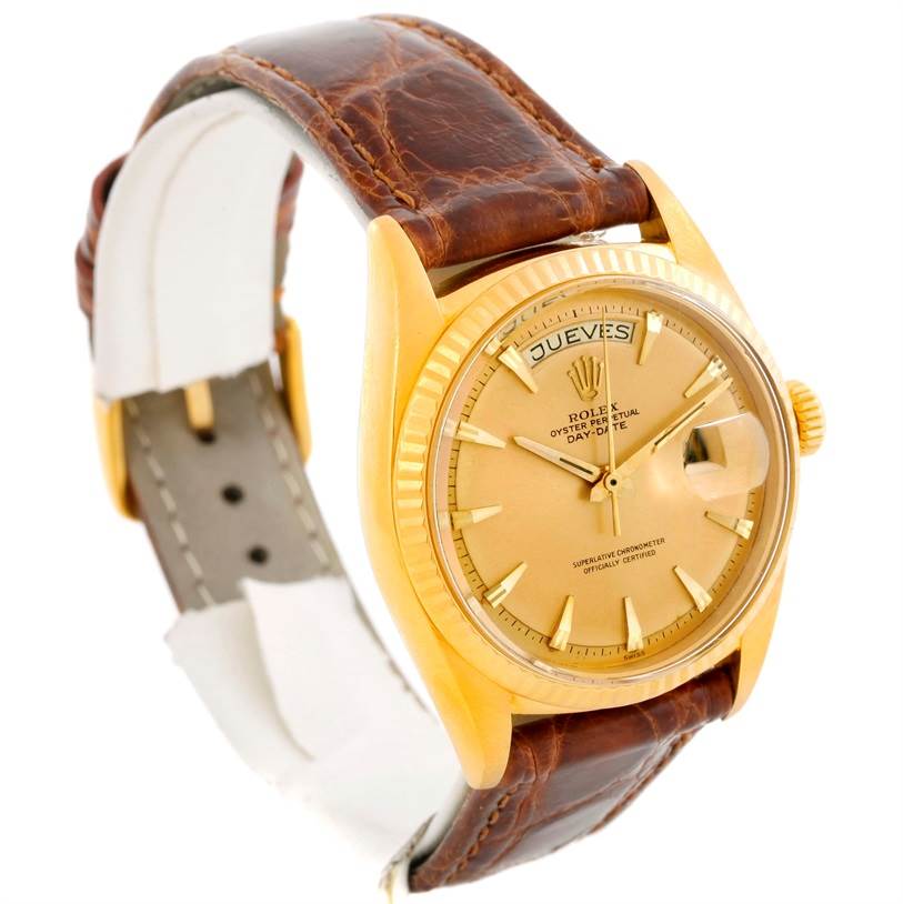 The image shows a side angle of a Rolex President 1803 Men
s Yellow Gold Champagne Dial 1803 Men
s Yellow Gold Champagne Dial model watch, highlighting its dial, fluted bezel, and leather strap.