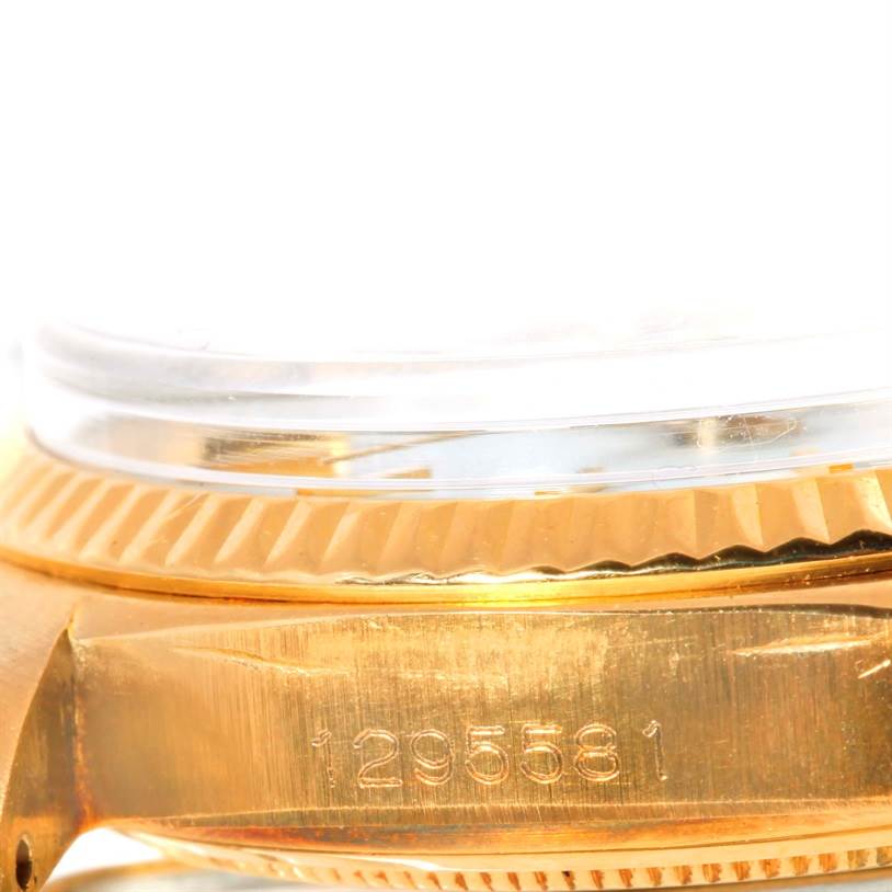 The close-up image shows the side bezel and case of a Rolex President 1803 Men
s Yellow Gold White Dial 1803 Men
s Yellow Gold White Dial model watch, highlighting its serial number.