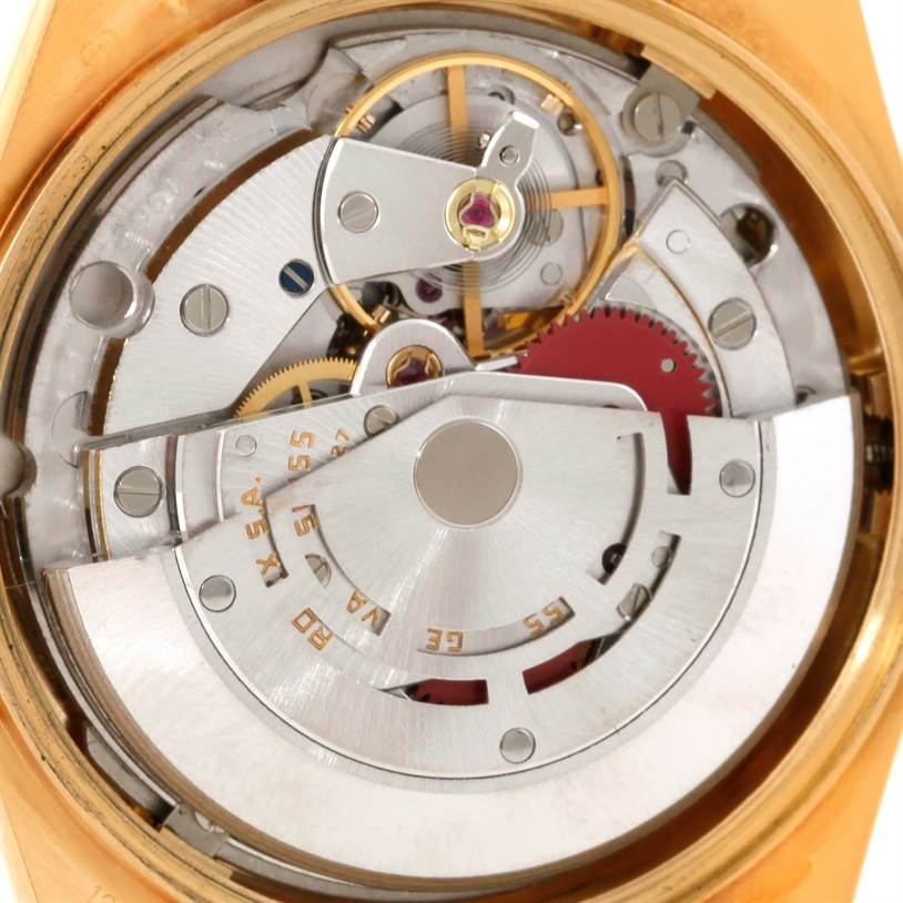 The image shows the inner mechanics and movement of a Rolex President 18038 Men
s Yellow Gold Champagne Dial 18038 Men
s Yellow Gold Champagne Dial model watch from a close-up, top-down angle.