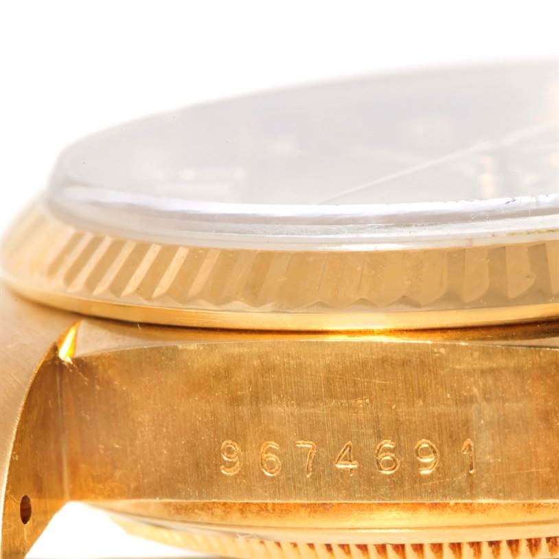 This image shows a close-up side view of the case and bezel of a Rolex President 18038 Men
s Yellow Gold Champagne Dial 18038 Men
s Yellow Gold Champagne Dial model watch.
