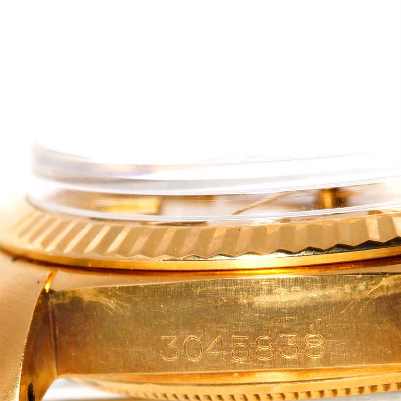 The image shows a close-up side angle of the Rolex President 1803 Men
s Yellow Gold Champagne Dial 1803 Men
s Yellow Gold Champagne Dial model
s serial number on the case.