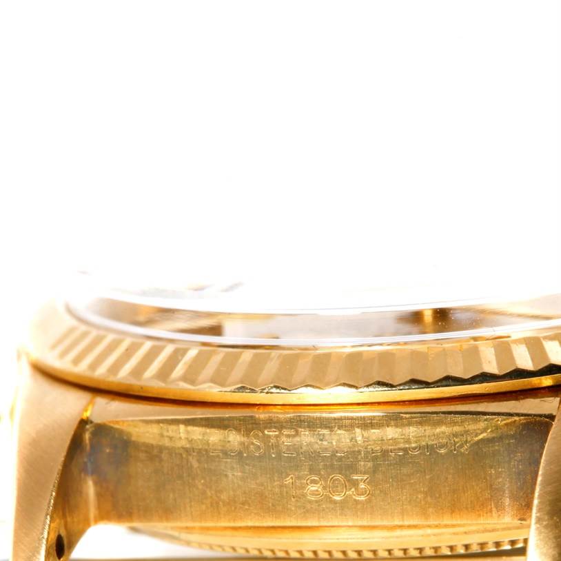 This close-up image shows the side view of the case and fluted bezel of a Rolex President 1803 Men
s Yellow Gold Champagne Dial 1803 Men
s Yellow Gold Champagne Dial model watch.