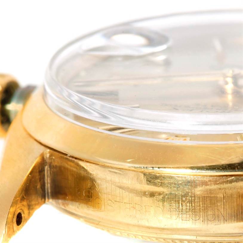 This image shows a close-up side angle of a Rolex President 1500 Men
s Yellow Gold Champagne Dial 1500 Men
s Yellow Gold Champagne Dial watch, highlighting the gold case and crystal lens.