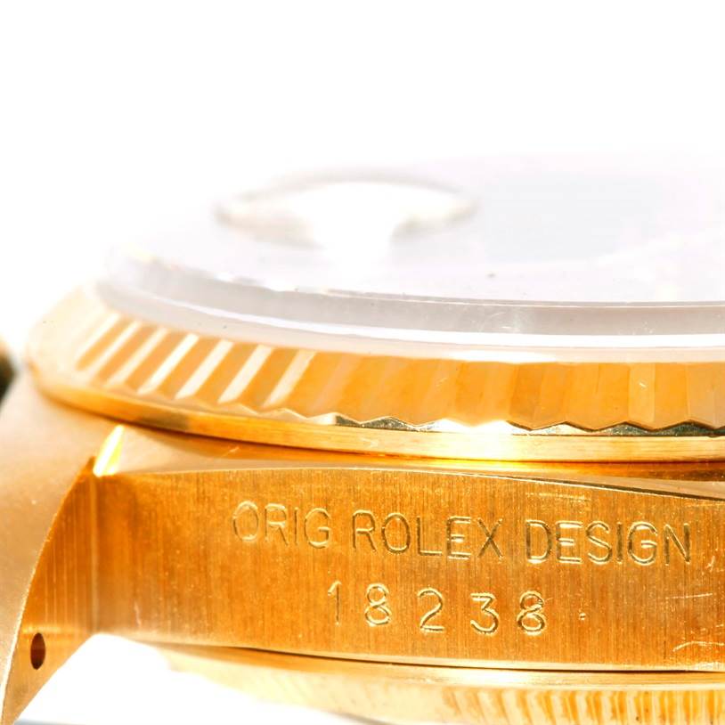 The image shows a close-up side view of the case and bezel of a Rolex President 18238 Men
s Yellow Gold Champagne Dial 18238 Men
s Yellow Gold Champagne Dial model watch, highlighting the "ORIG ROLEX DESIGN 18238" engraving.