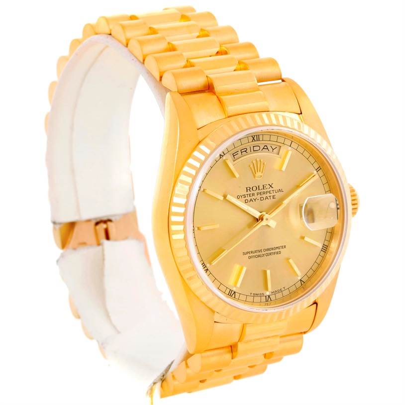 This image shows a Rolex President 18238 Men
s Yellow Gold Champagne Dial 18238 Men
s Yellow Gold Champagne Dial model watch at a three-quarter angle, displaying its bracelet, dial, day-date window, and fluted bezel.