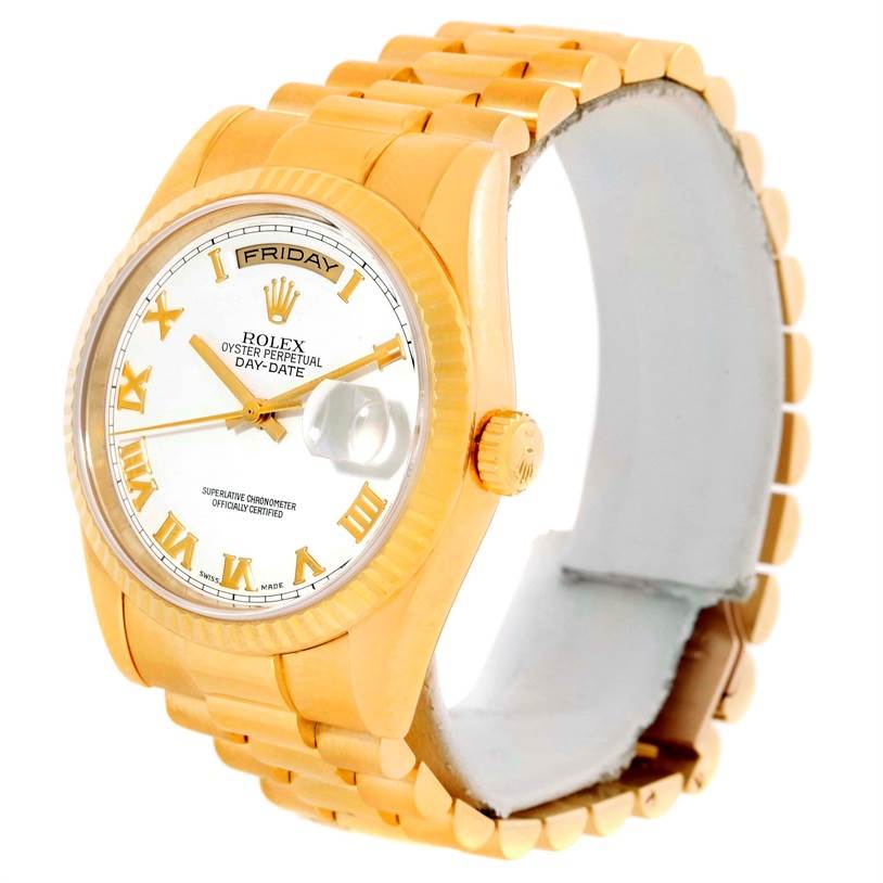The image shows a Rolex President 118238 Men
s Yellow Gold White Dial 118238 Men
s Yellow Gold White Dial model watch from an angle highlighting its gold bracelet, white dial, Roman numerals, and date window.